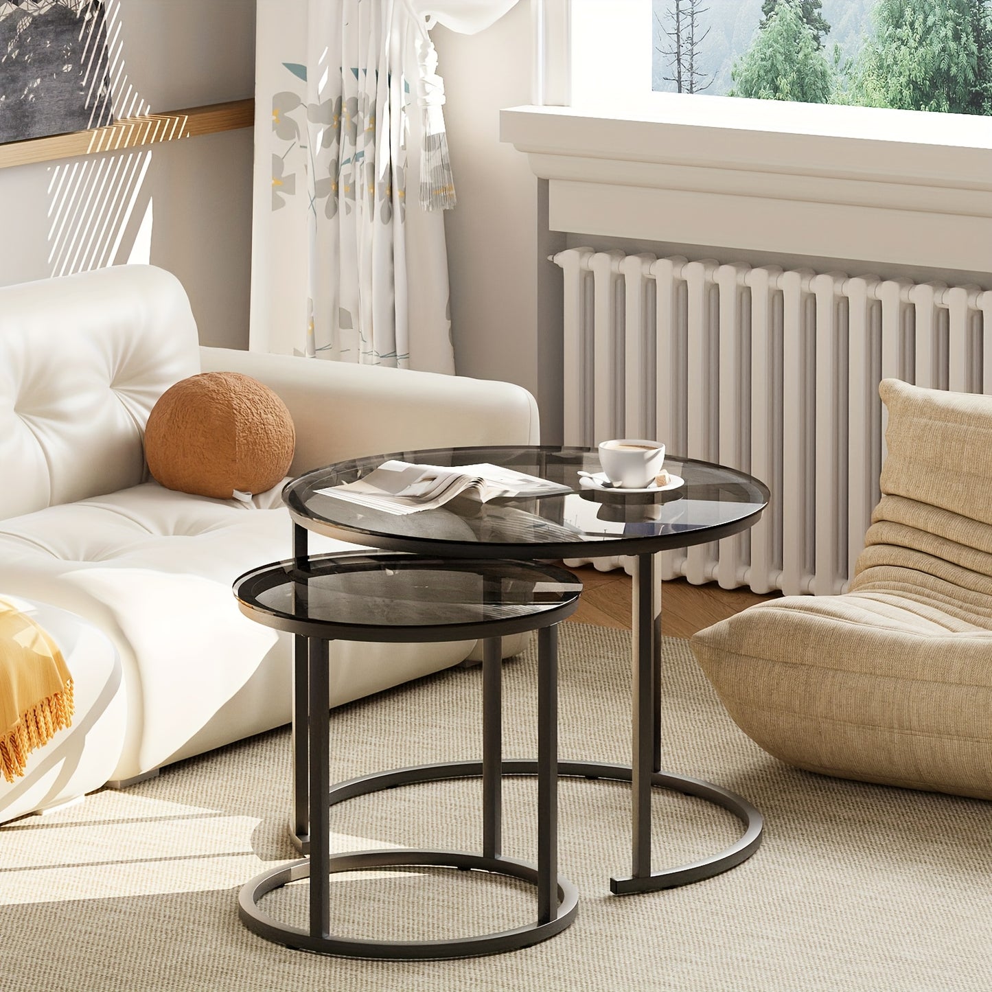 Set of Two Nesting Glass Coffee Tables, Featuring Small Round Designs Suitable for Living Rooms Or Bedrooms, with a Modern Industrial Style And a Black Metal Frame.